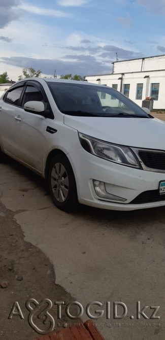Selling Kia Rio 2013 in good condition, 'prestige' equipment, front and side airbags... in Akmola region  Akmola Region - photo 1